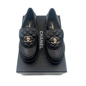 CHANEL Black and Gold Leather Flats with Iconic Logo